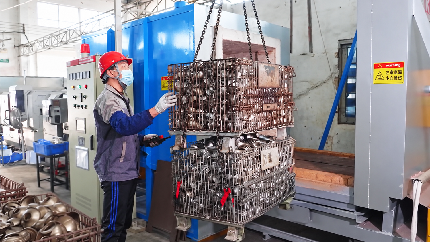 Stainless steel components being loaded into an annealing furnace